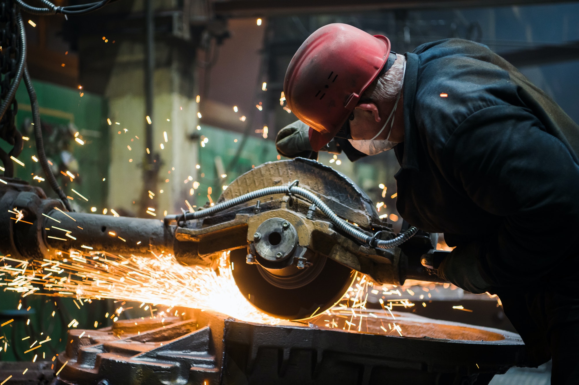 worker-grinding-metal-metal-grinding-machine-with-sparks-metal-sawing.jpg